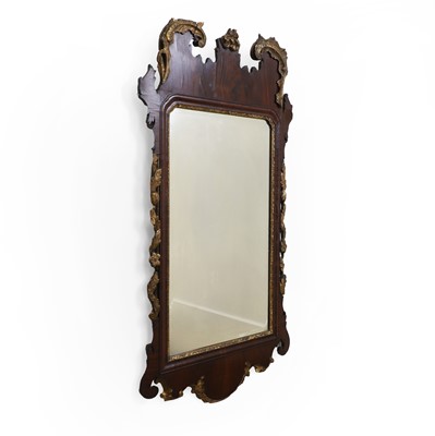 Lot 474 - A George II mahogany and parcel gilt mirror