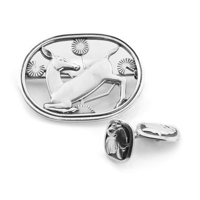 Lot 246 - A sterling silver kneeling deer brooch, by Georg Jensen