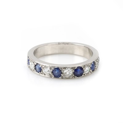 Lot 90 - A sapphire and diamond half eternity ring