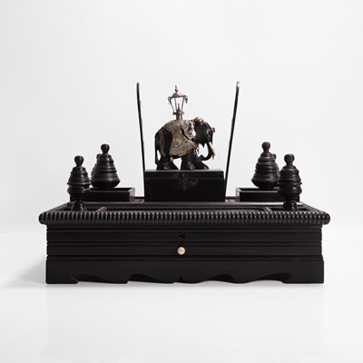 Lot 164 - An ebonised desk stand