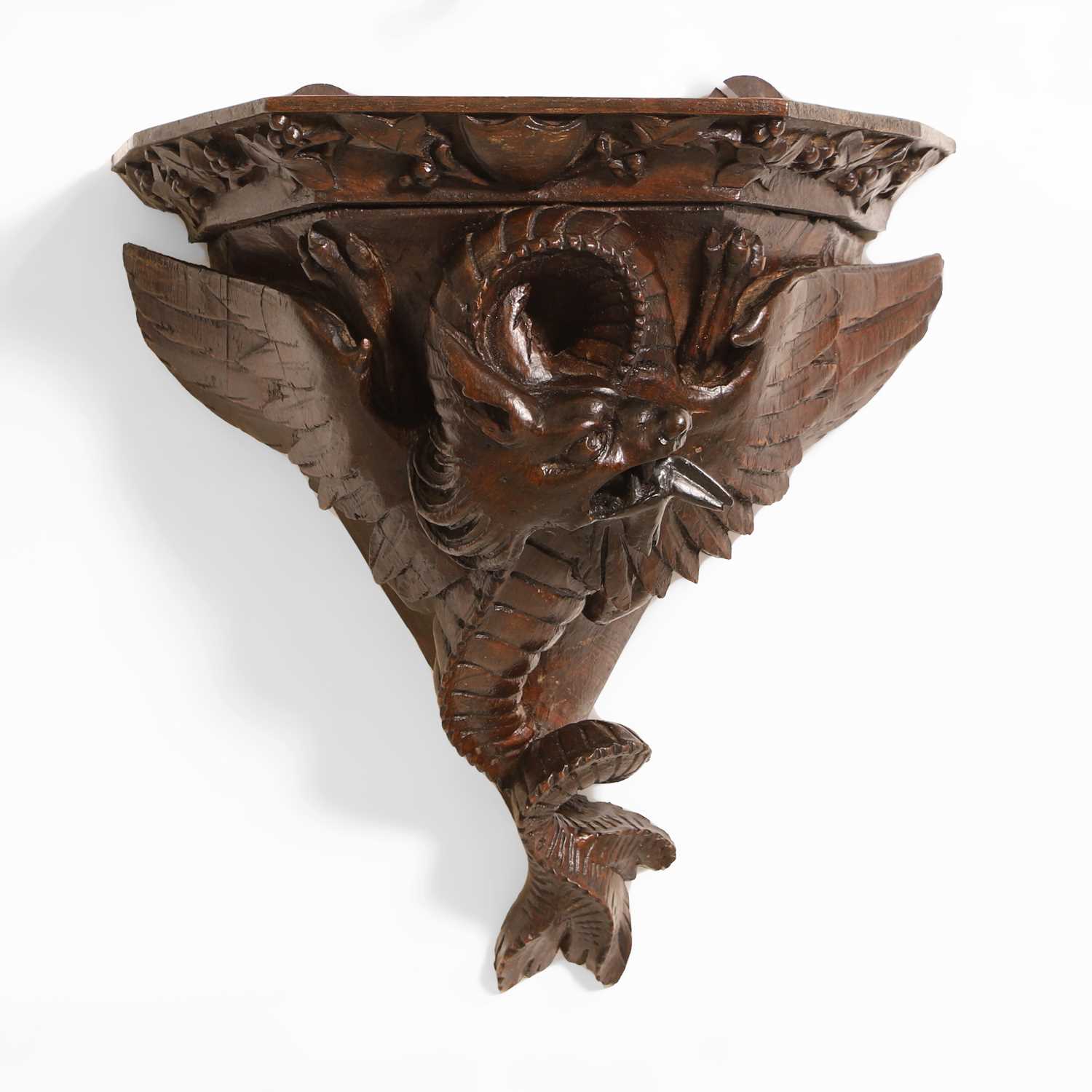 Lot 59 - A carved oak Arts & Crafts wall bracket