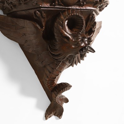 Lot 59 - A carved oak Arts & Crafts wall bracket