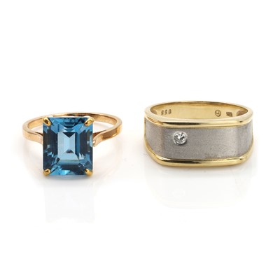 Lot 335 - An 18ct gold topaz single stone ring and a two colour gold diamond ring