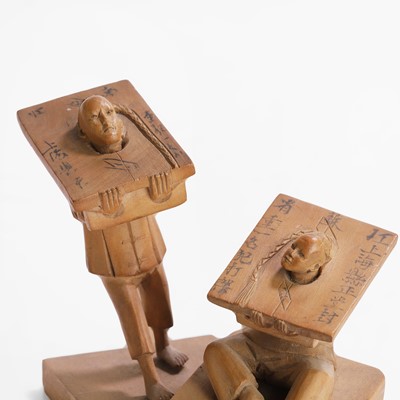 Lot 238 - A pair of Chinese punishment carved wooden figures