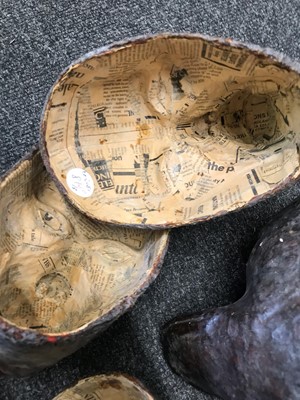 Lot 44 - A strange group of papier mâché masks
