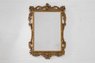 Lot 468 - A carved giltwood pier mirror in the rococo taste