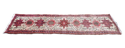 Lot 307 - A hand knotted Persian cream ground runner
