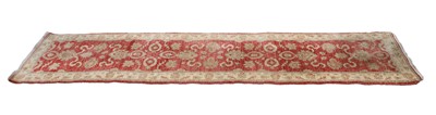 Lot 312 - A hand knotted Agra red ground runner