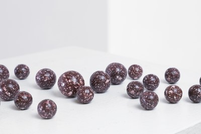 Lot 520 - A collection of imperial porphyry balls or gaming pieces
