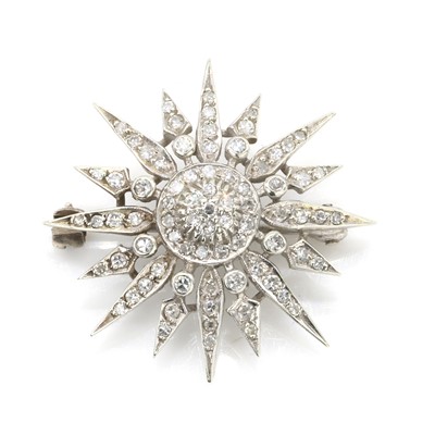 Lot 80 - A diamond starburst brooch