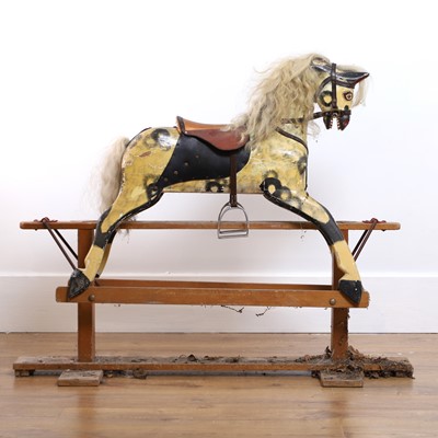 Lot 276 - A carved and painted rocking horse
