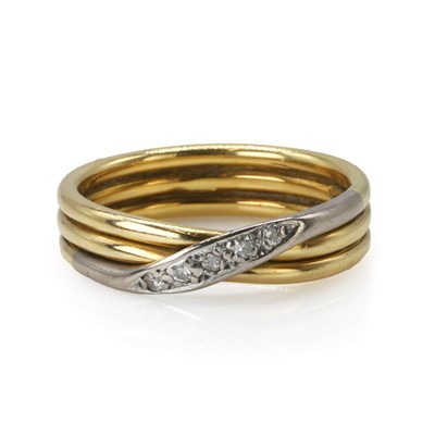 Lot 107 - An 18ct two colour gold diamond crossover ring