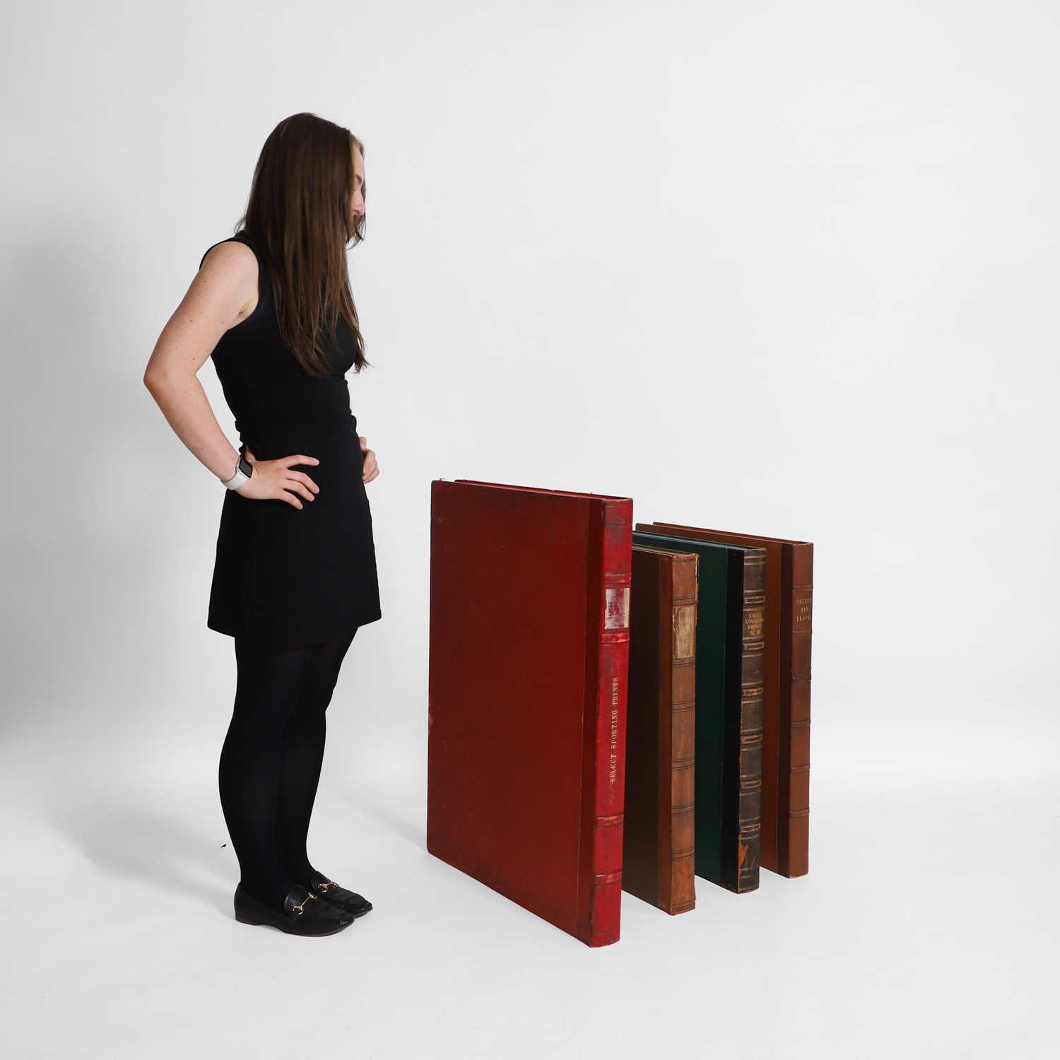 Lot 434 - A set of four large faux book print boxes