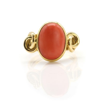 Lot 169 - A coral single stone ring