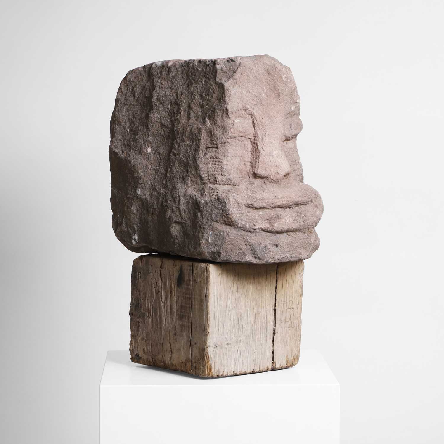 Lot 139 - An apotropaic carved stone head