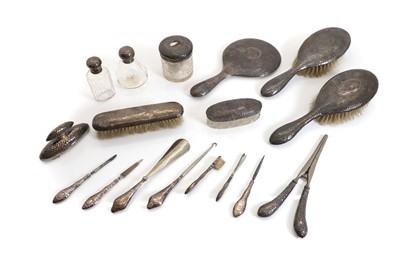 Lot 44 - A planished silver dressing table set and related items