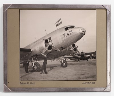 Lot 458 - A framed photograph of a Douglas DC3 plane