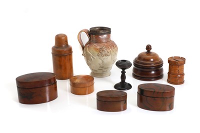 Lot 242 - A treen castellated money box