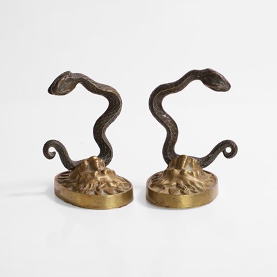 Lot 43 - A pair of serpent and lion curtain tie-backs