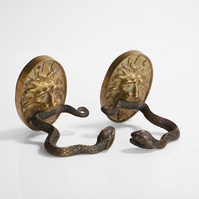 Lot 43 - A pair of serpent and lion curtain tie-backs