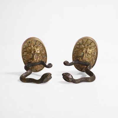 Lot 43 - A pair of serpent and lion curtain tie-backs