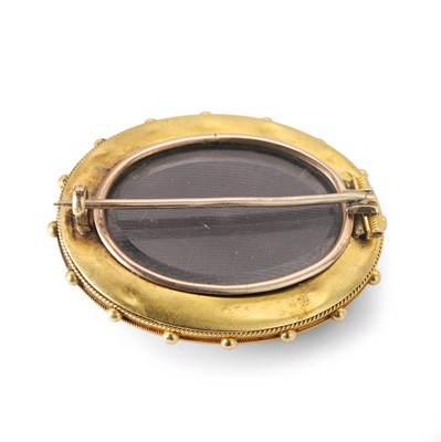 Lot 7 - A Victorian onyx and split pearl mourning brooch