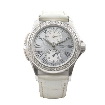 Lot 287 - An 18ct gold diamond set Patek Philippe Travel Time Calatrava automatic strap watch
