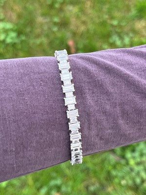 Lot 231 - A platinum and diamond line bracelet