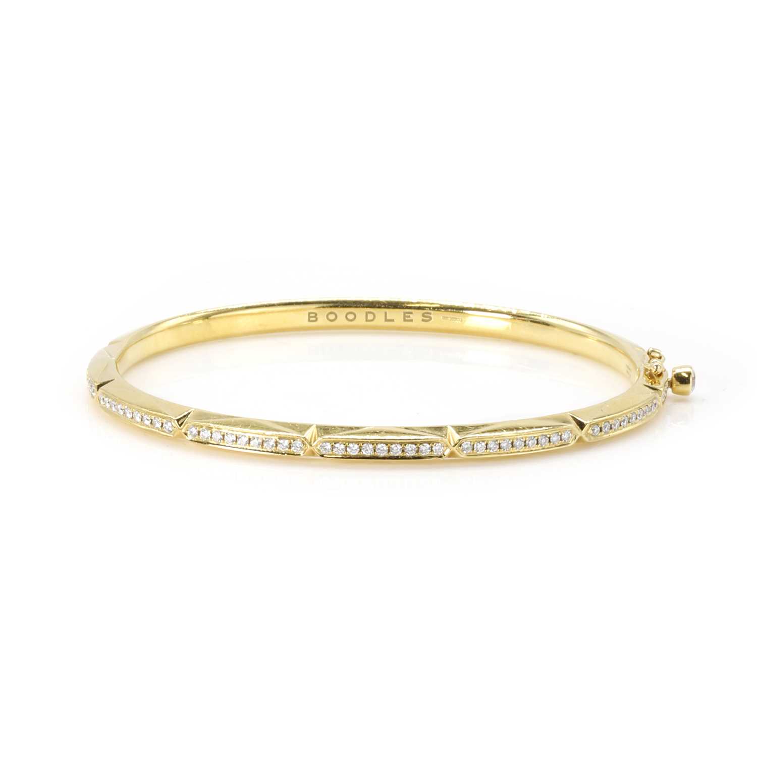 Lot 220 - An 18ct gold diamond Jazz bangle, by Boodles