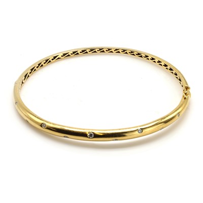 Lot 209 - An 18ct gold diamond bangle, by Mappin & Webb