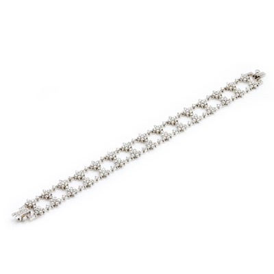 Lot 237 - An 18ct white gold diamond bracelet, retailed by Mappin & Webb