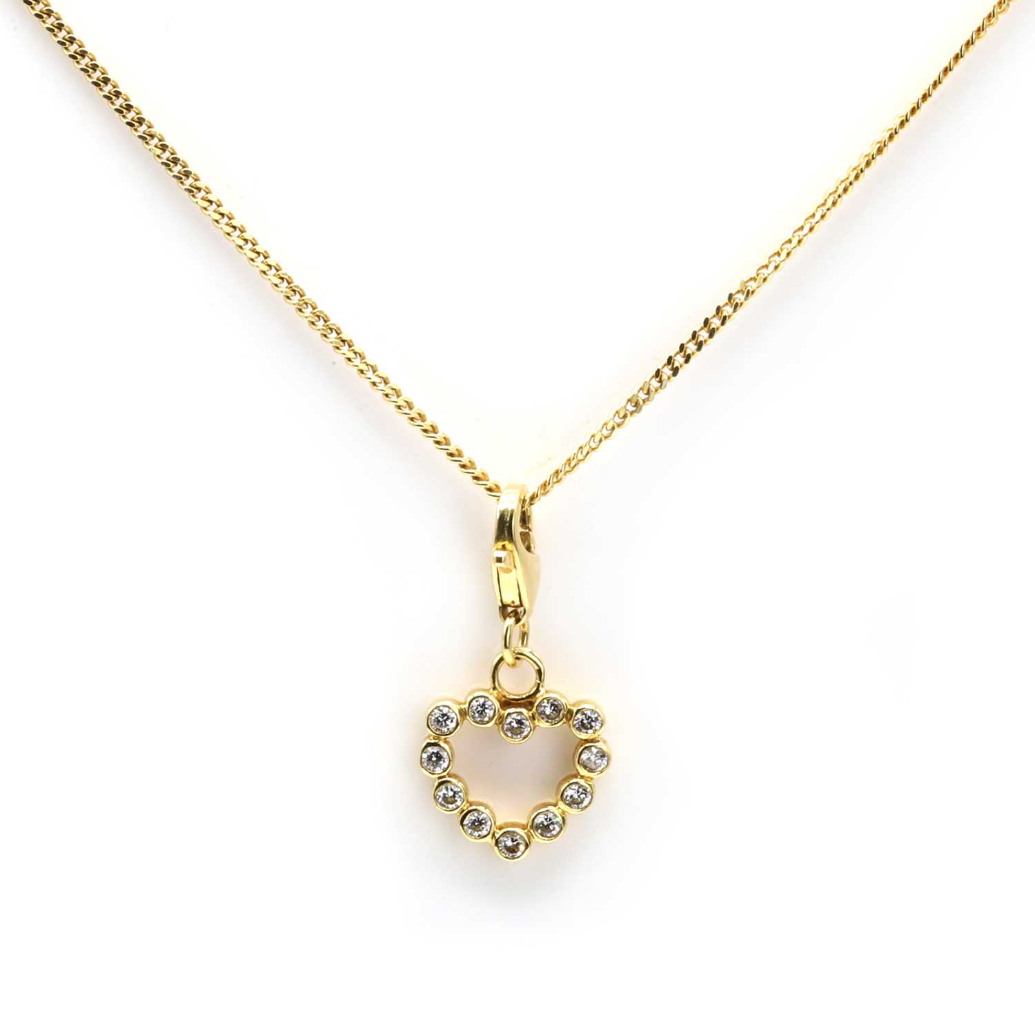 Lot 87 - An 18ct gold diamond heart pendant necklace, retailed by Mappin & Webb