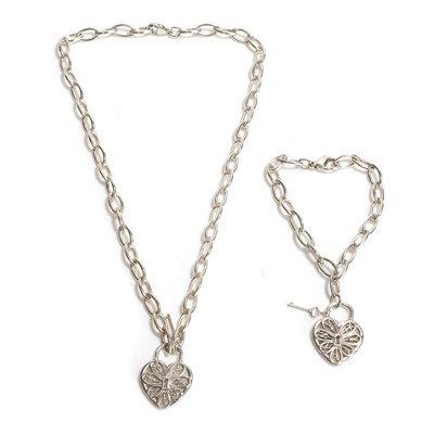 Lot 251 - A sterling silver heart key pendant and bracelet set, by Tiffany & Co.