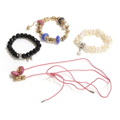 Lot 256 - A 14ct gold charm bracelet by Pandora and two bracelets by Thomas Sabo