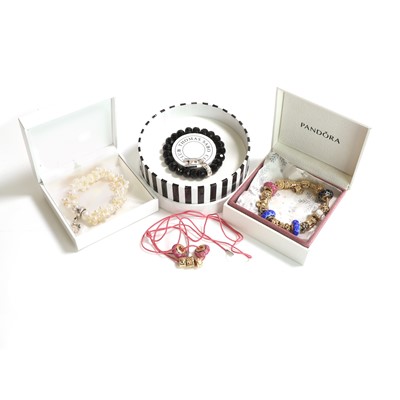 Lot 256 - A 14ct gold charm bracelet by Pandora and two bracelets by Thomas Sabo