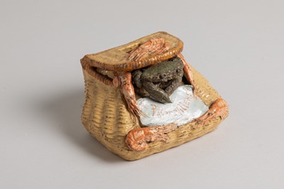 Lot 215 - A glazed pottery wall pocket or salt box