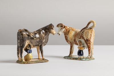 Lot 338 - Two Staffordshire cow creamers