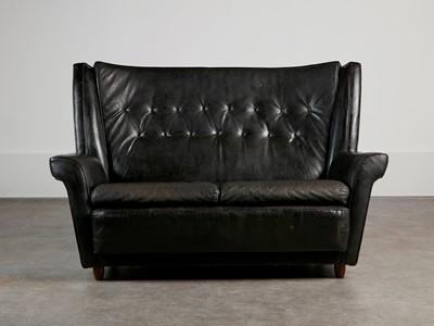 Lot 304 - A leather settee