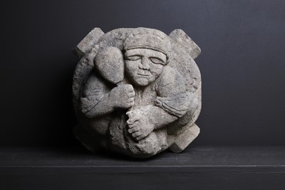 Lot 573 - A carved stone corbel of a stonemason
