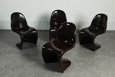 Lot 214 - A set of four brown fibreglass 'S' chairs