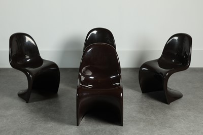 Lot 214 - A set of four brown fibreglass 'S' chairs