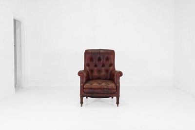 Lot 237 - A buttoned-leather library armchair