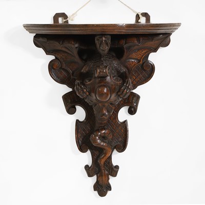 Lot 58 - An oak Arts & Crafts carved wall bracket