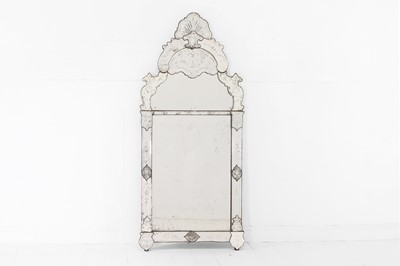 Lot 273 - A baroque etched glass mirror