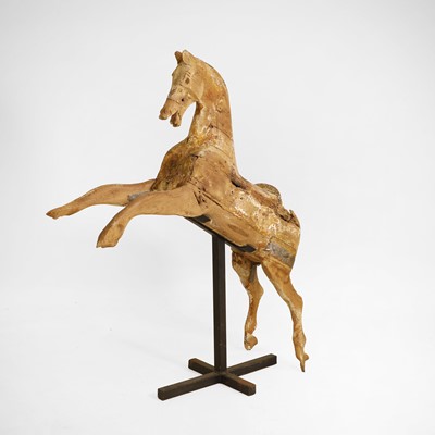 Lot 104 - A primitive galloper on stand