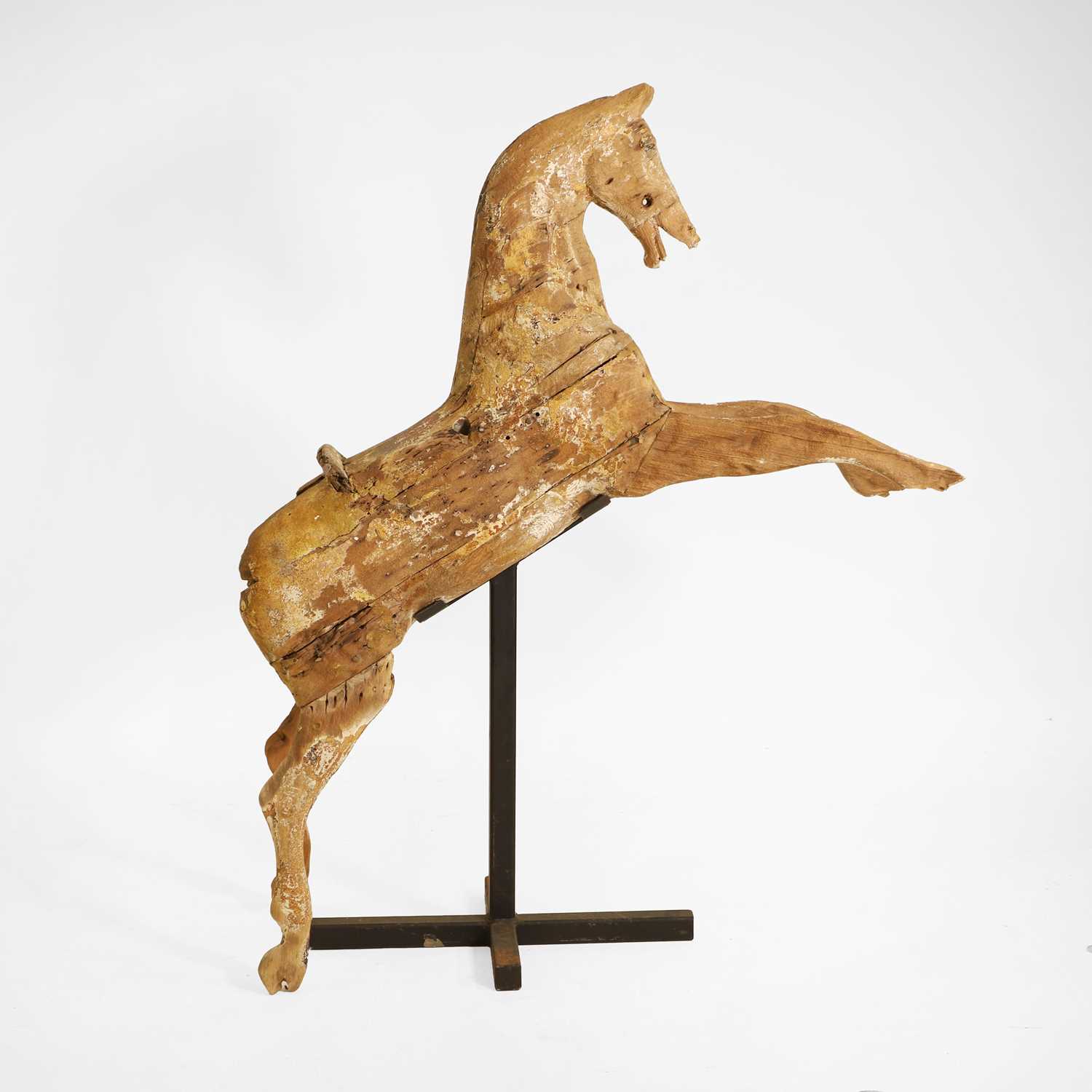 Lot 104 - A primitive galloper on stand