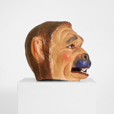 Lot 77 - A papier mâché monkey-man head