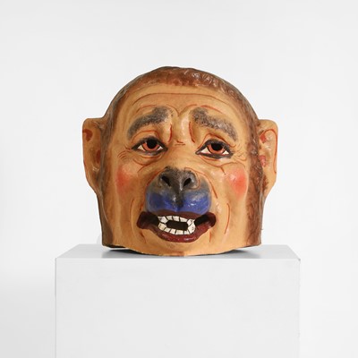 Lot 77 - A papier mâché monkey-man head