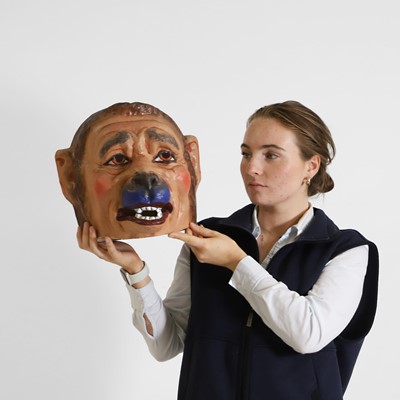 Lot 77 - A papier mâché monkey-man head