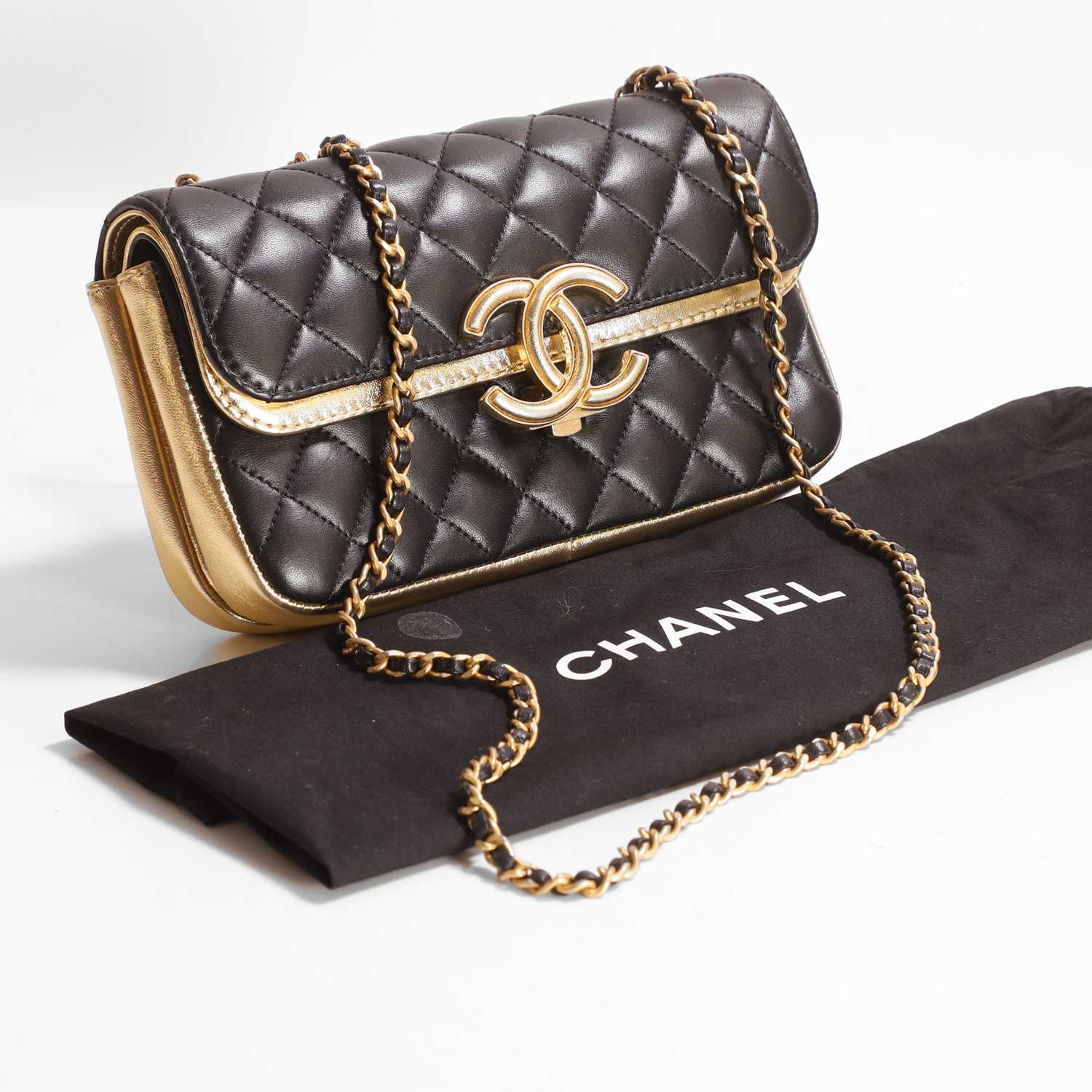 Lot 1456 - A Chanel black and gold foiled leather double-flap bag